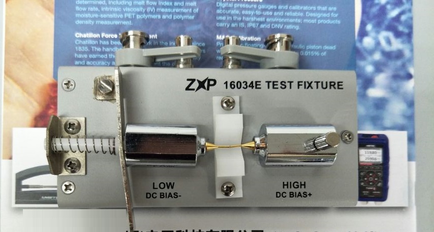 16034E